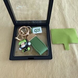 Green Keychain with Gold Accents